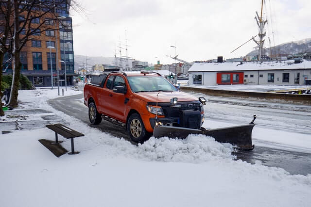 A snow plow clearing the streets